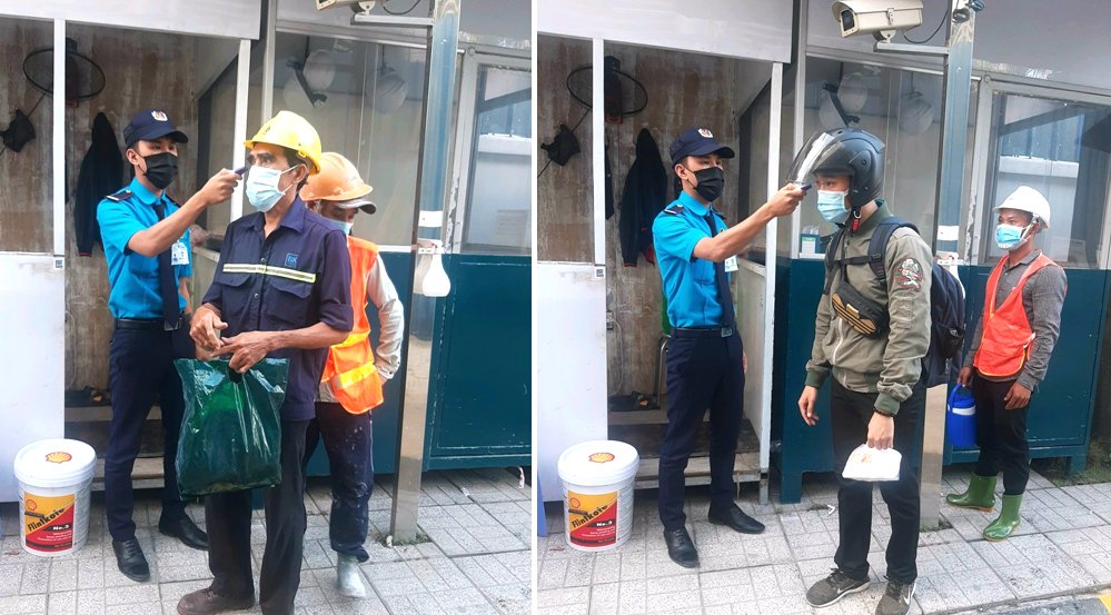 Đo thân nhiệt cho công nhân viên ra vào nhà máy